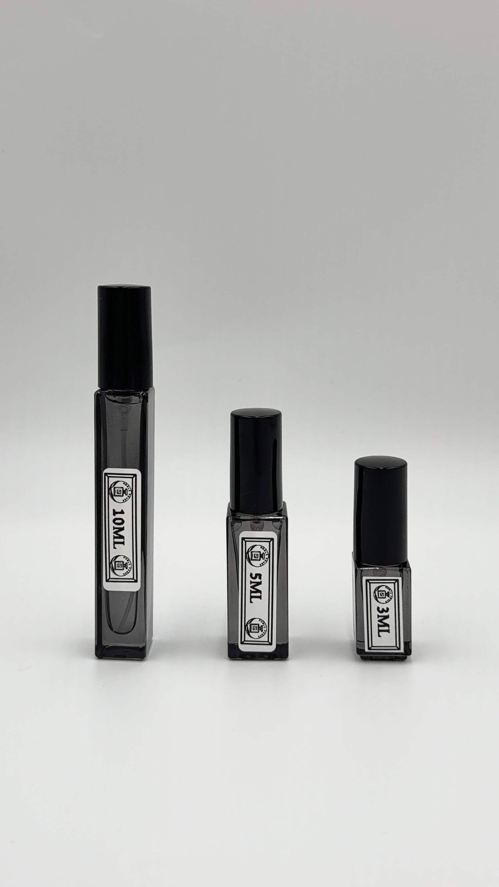 Noble Frags fragrance decant in a labeled travel atomizer