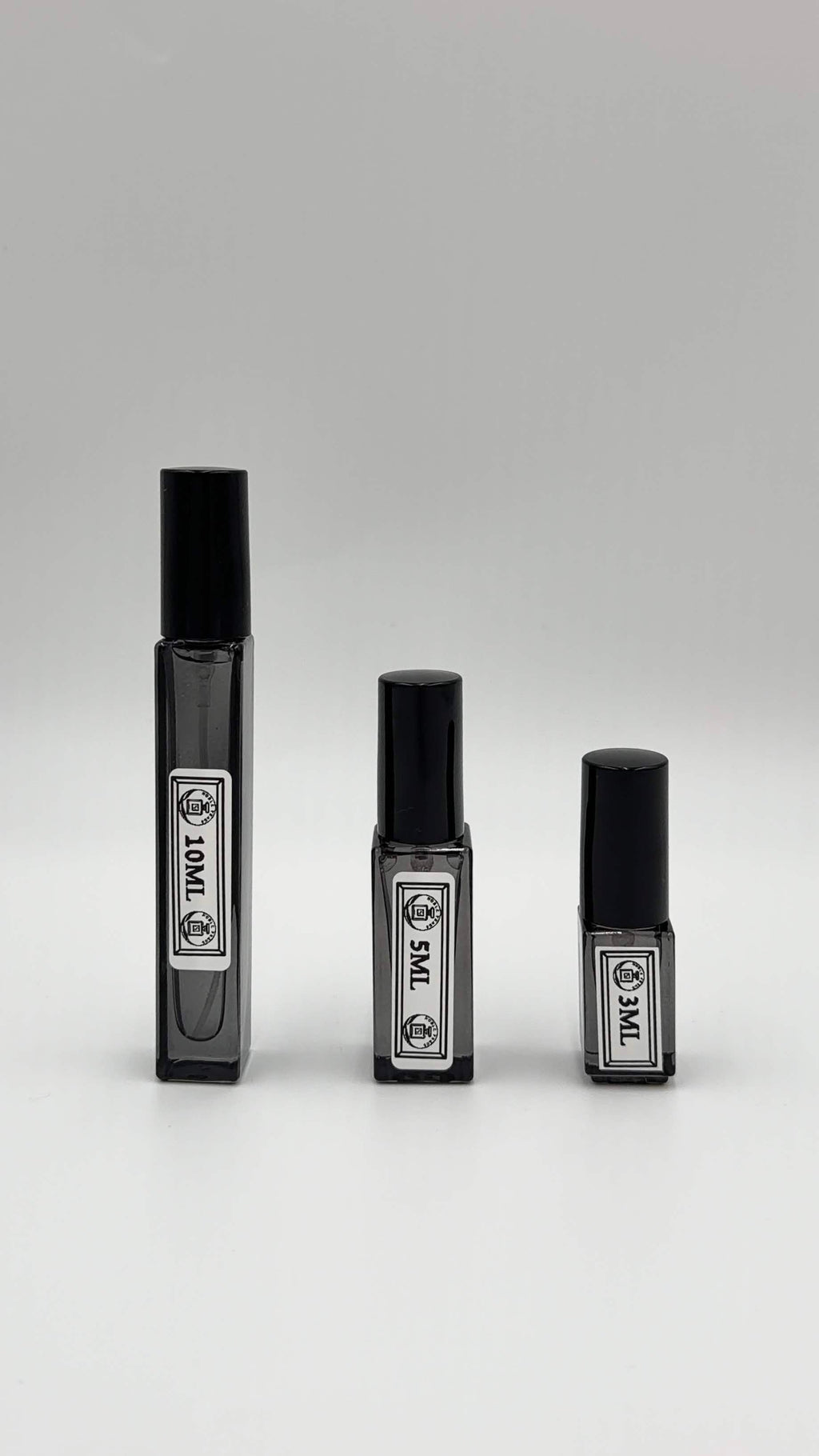 Noble Frags fragrance decant in a labeled travel atomizer