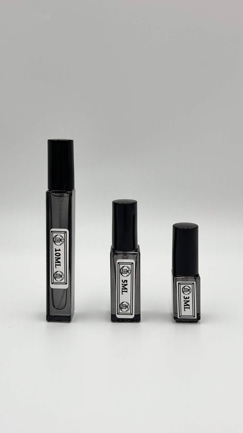 Noble Frags fragrance decant in a labeled travel atomizer